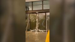 Watch: Moment water shatters glass doors of Hong Kong hotel