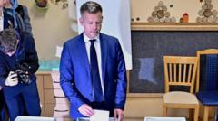 Hungarians vote on whether to end 16 years of Orbán rule and elect rival